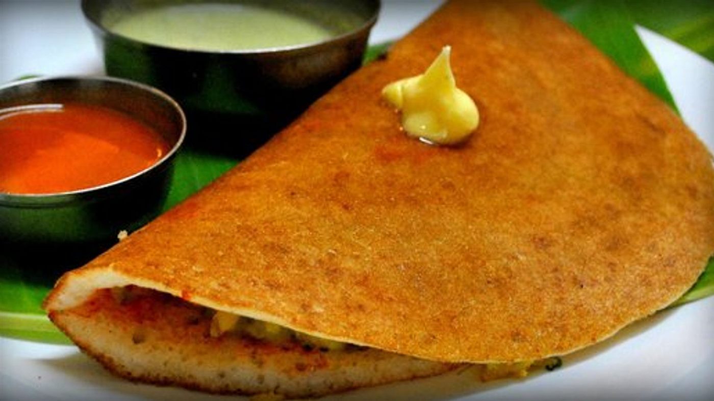 Masala dosa fresh off the griddle, served with chutneys and sambar